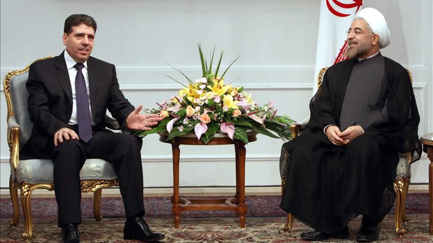 El primer ministro sirio, Wael Nader Al-Halqi, habla con el presidente iraní, Hassan Rohaní, El primer ministro sirio, Wael Nader Al-Halqi, habla con el presidente iraní, Hassan Rohaní,