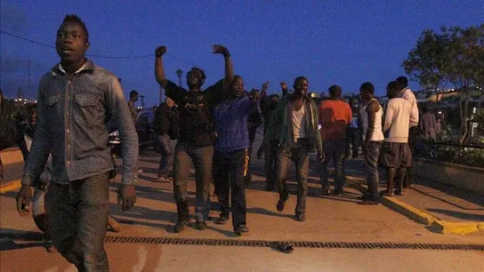 Inmigrantes en una calle de Melilla Inmigrantes en una calle de Melilla