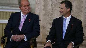 Don Juan Carlos y Felipe VI en un acto