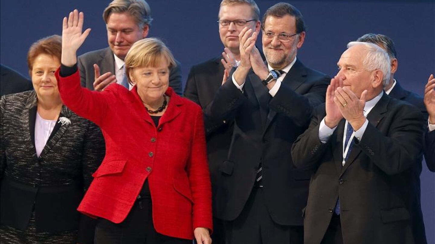 Angela Merkel, Mariano Rajoy y el presidente del PPE, Joseph Daul