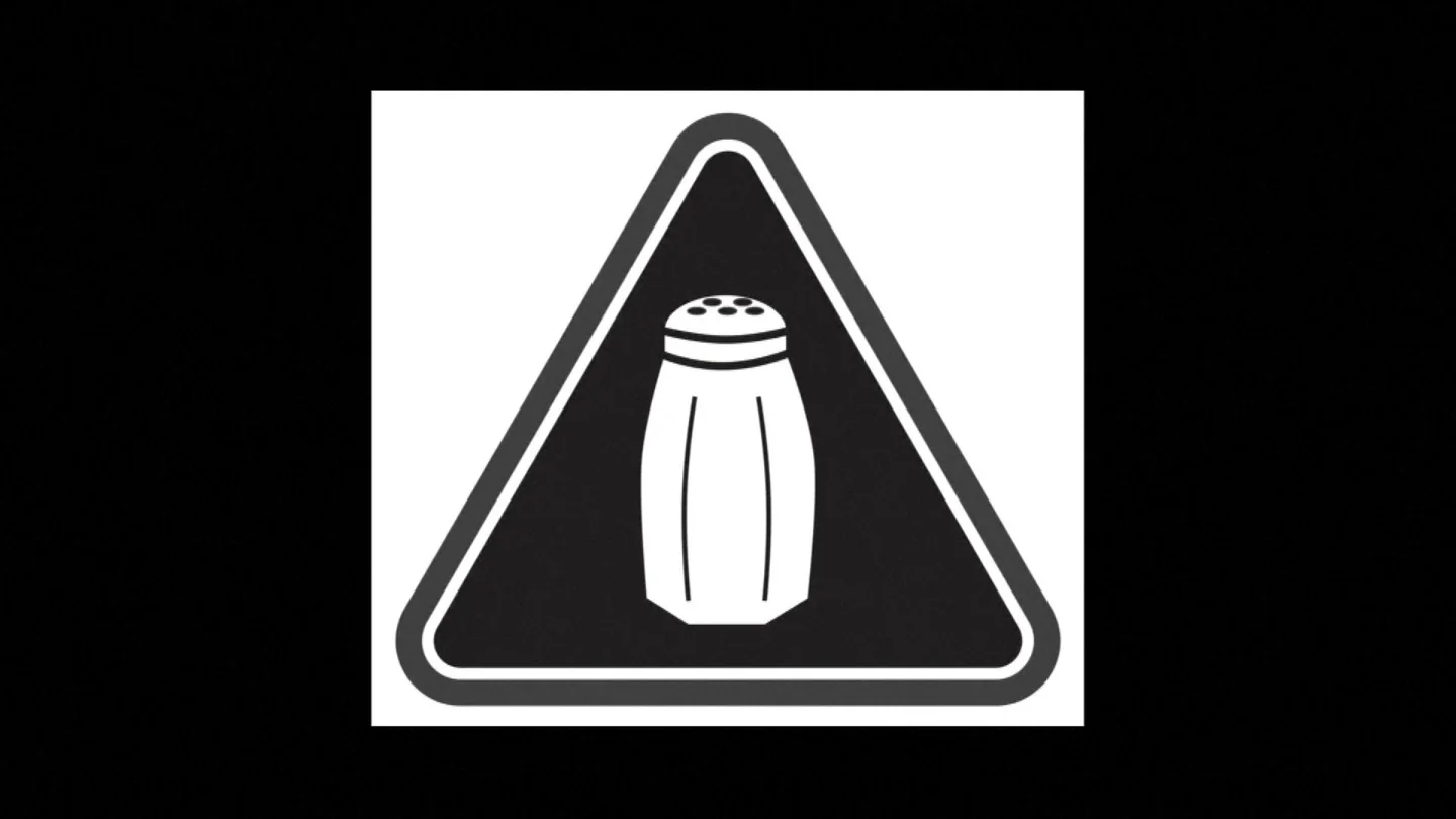 Símbolo que advierte del exceso de sal en las comidas Símbolo que advierte del exceso de sal en las comidas