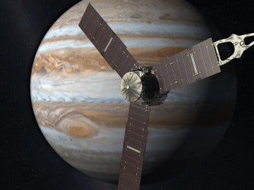 Representación artística de la sonda Juno sobre el planeta Júpiter y algunos de sus satélites.