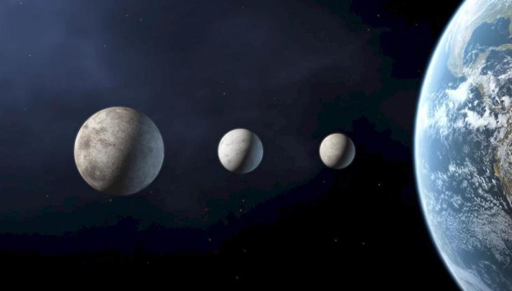 Xena, Charon y Ceres, con el planeta Tierra a su derecha