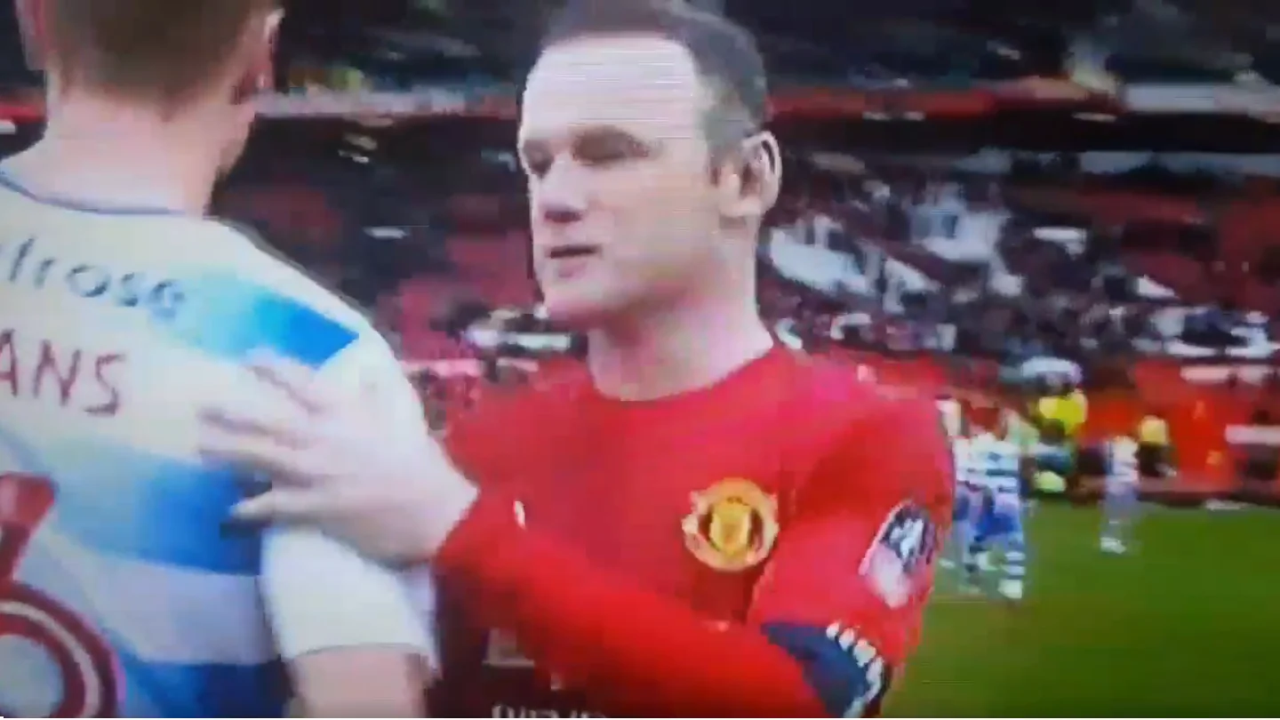 Rooney y George Evans al terminar el partido Rooney y George Evans al terminar el partido