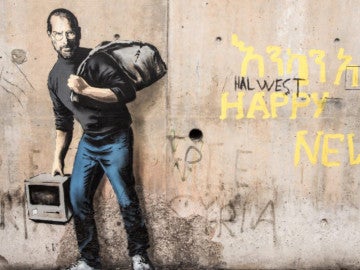 Grafiti de Banksy en el centro de refugiados ‘La Jungla’ de Calais Grafiti de Banksy en el centro de refugiados ‘La Jungla’ de Calais