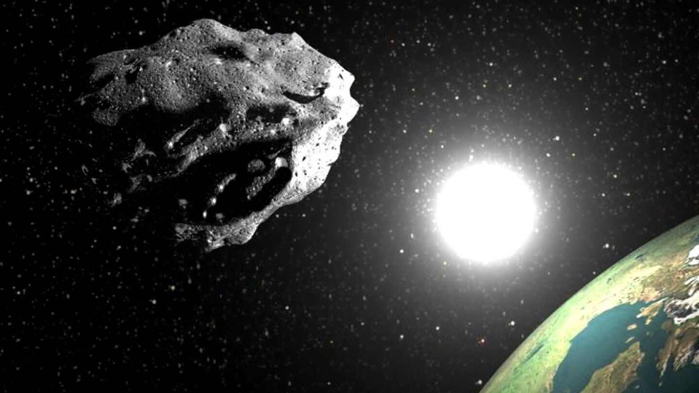 Recreaci&oacute;n de un asteroide con el Sol y la Tierra