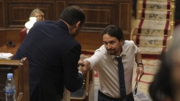El líder de Podemos, Pablo Iglesias, y el portavoz del PSOE, José Luis Ábalos