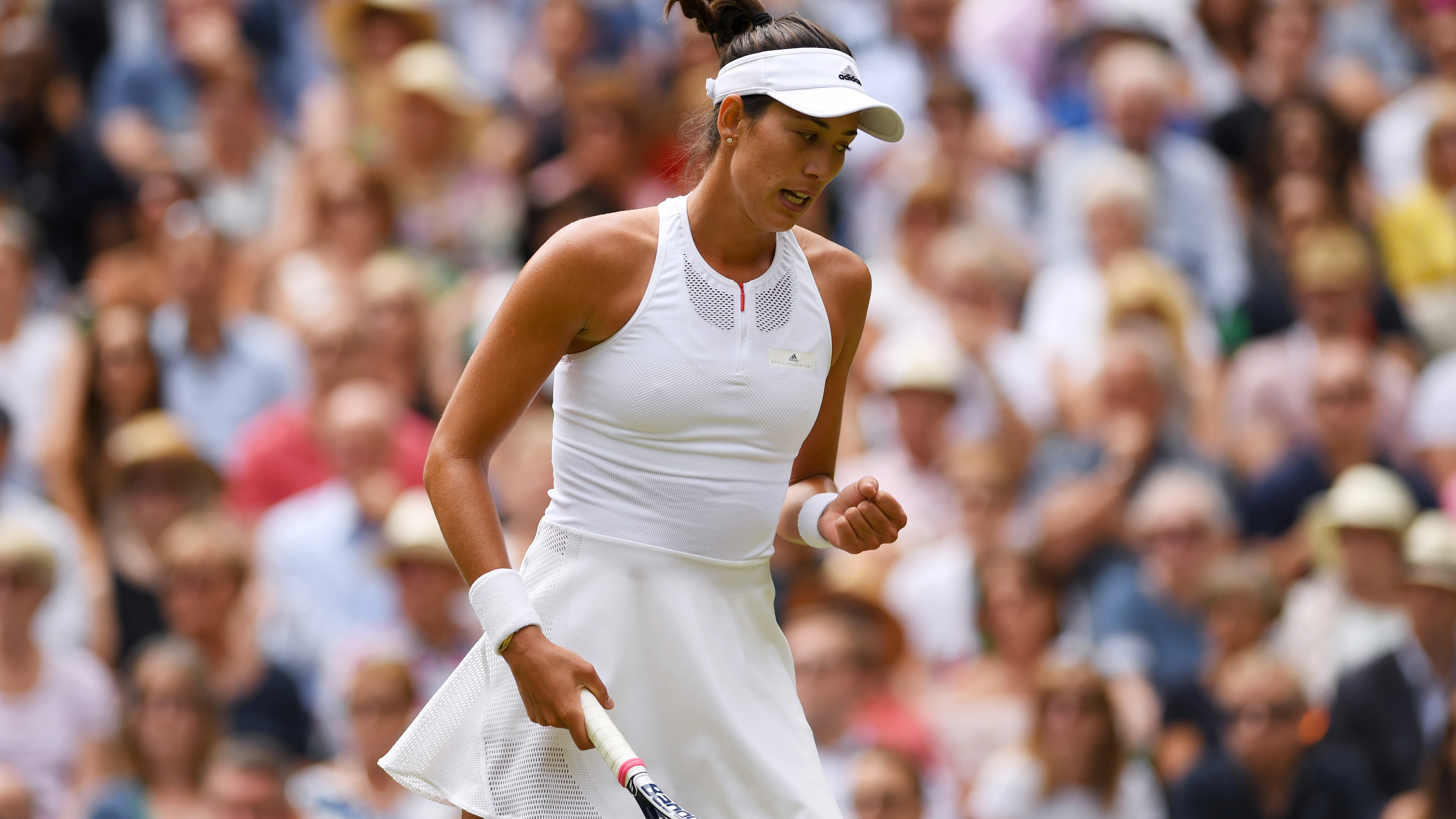 Muguruza celebra un punto ante Rybarikova