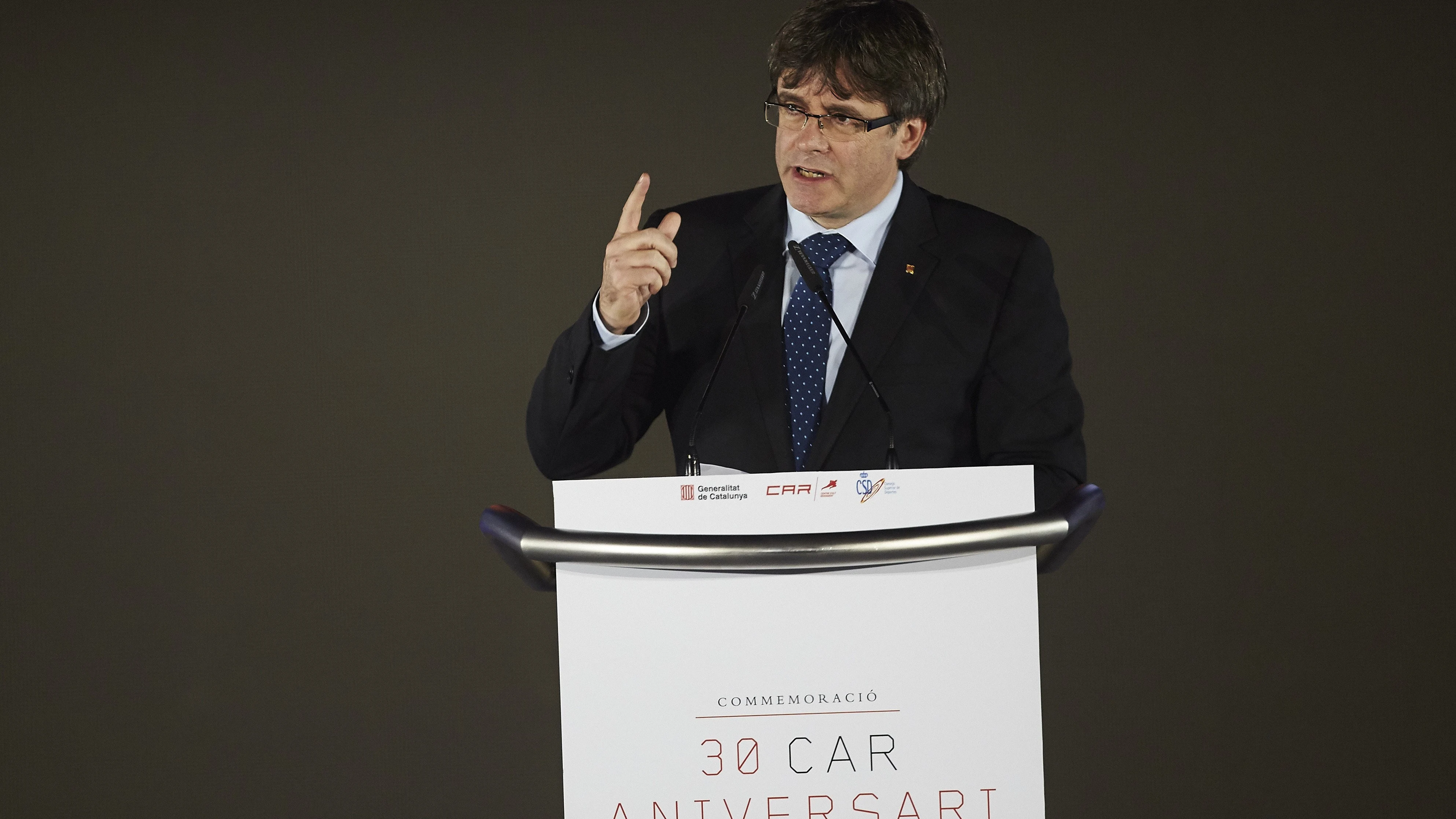 El presidente de la Generalitat, Carles Puigdemont, interviene en el el acto de la conmemoración del XXX Aniversario del CAR de Sant Cugat, un acto presidido por el Rey Felipe VI 