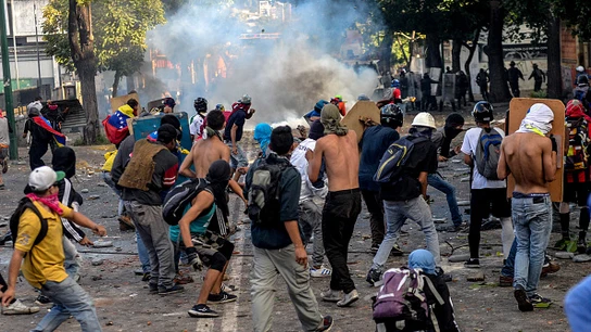 Manifestantes durante una protesta en Venezuela Manifestantes durante una protesta en Venezuela