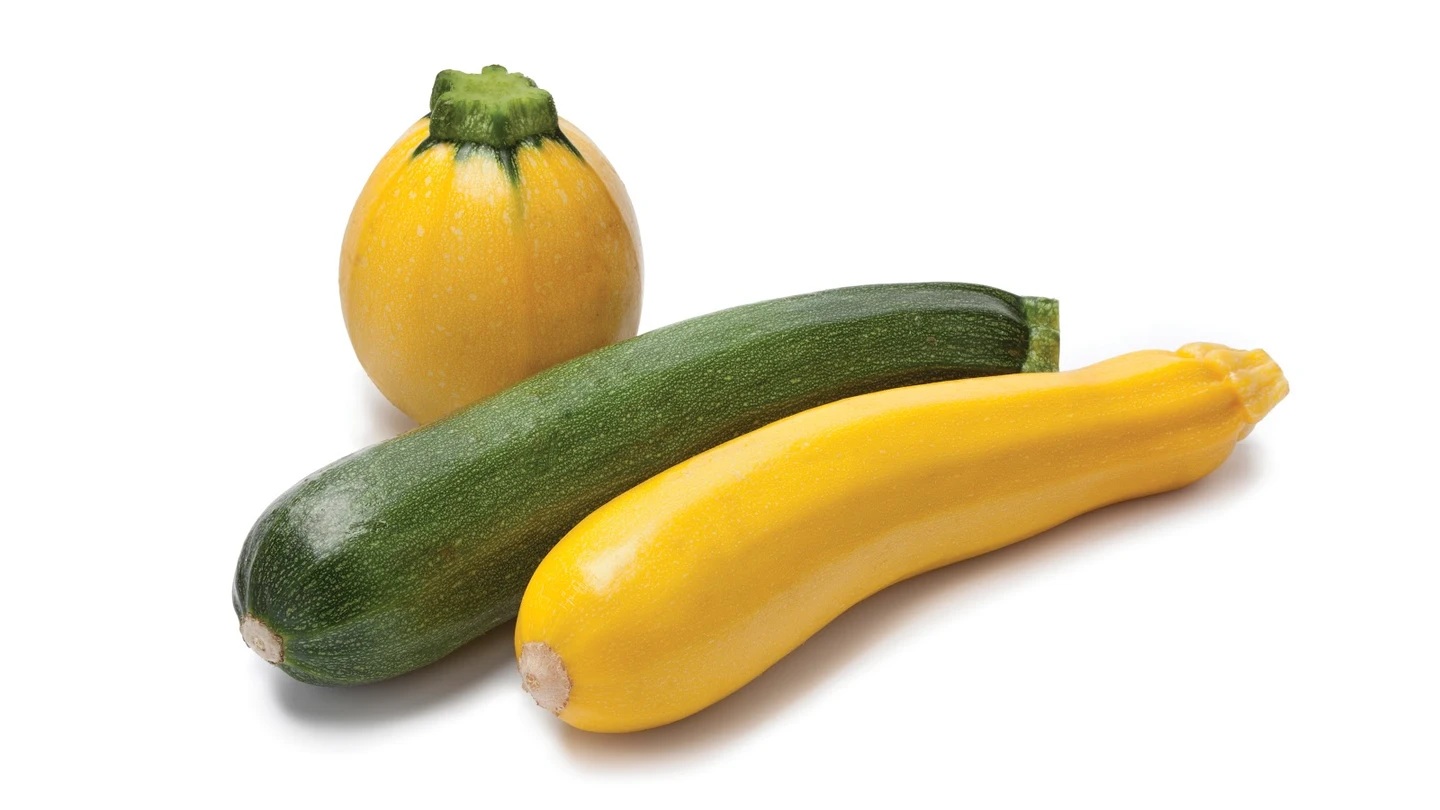 Un calabacín amarillo y otro verde Un calabacín amarillo y otro verde