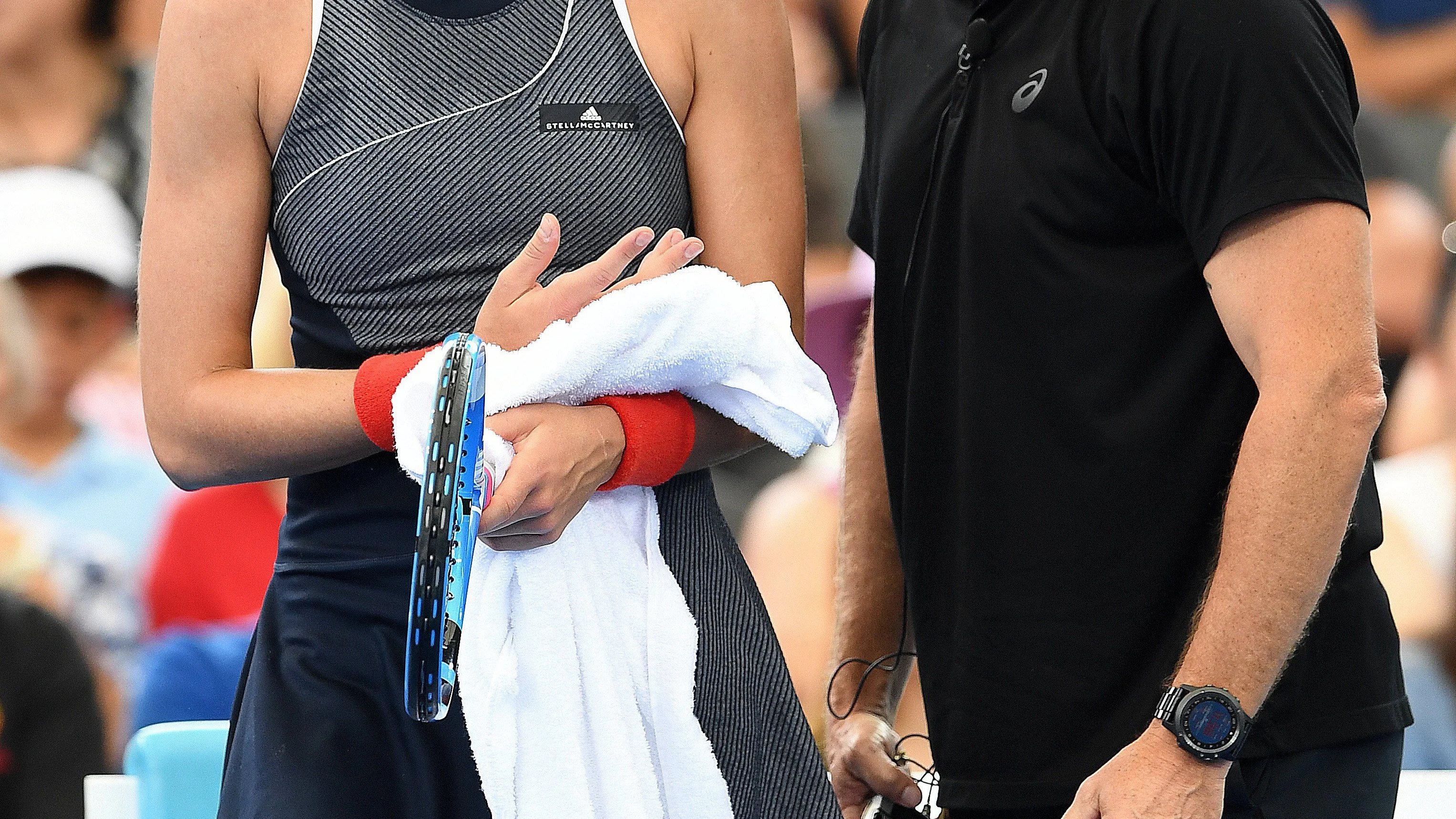 Muguruza, junto a su entrenador en Sídney