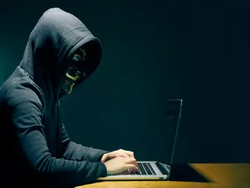 Un usuario en su ordenador Un usuario en su ordenador