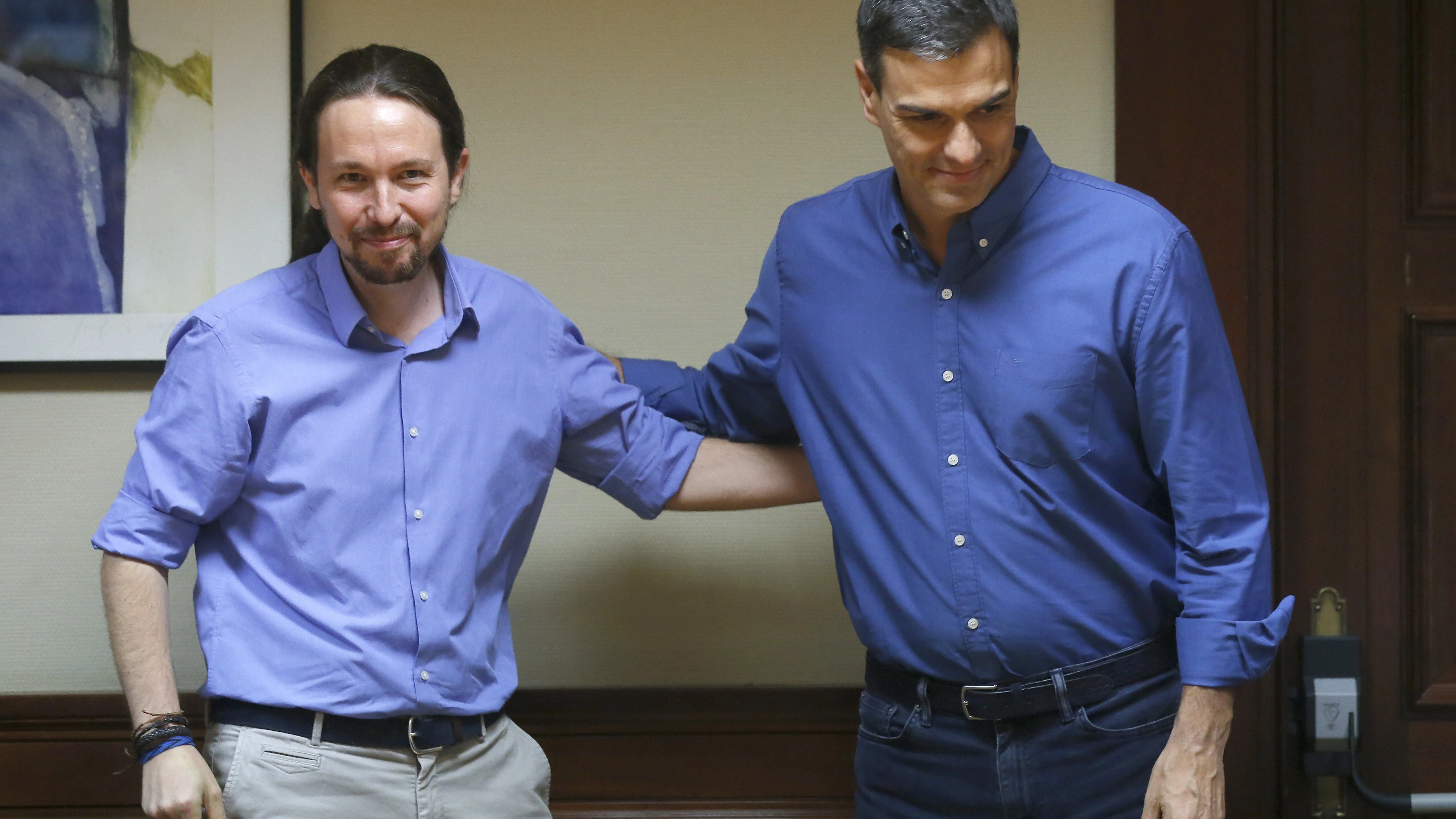 El presidente del Gobierno, Pedro Sánchez, y el líder de Podemos, Pablo Iglesias