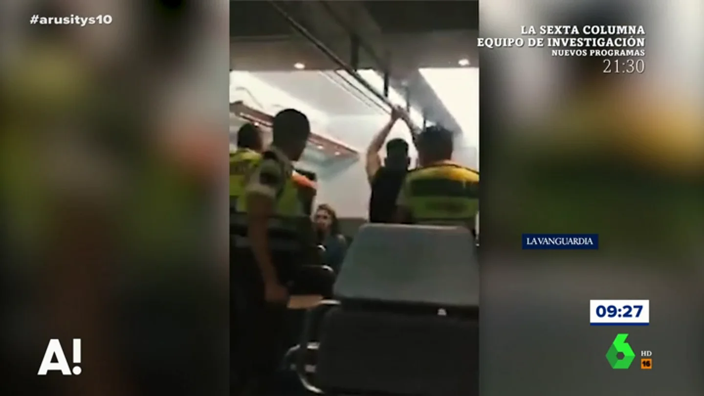 Un guarda de seguridad se muestra agresivo Un guarda de seguridad se muestra agresivo
