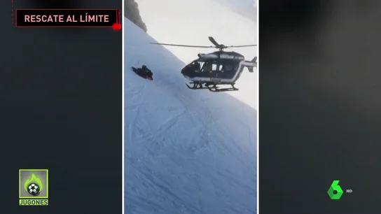 Rescate extremo en helicóptero de un esquiador accidentado en los Alpes Rescate extremo en helicóptero de un esquiador accidentado en los Alpes
