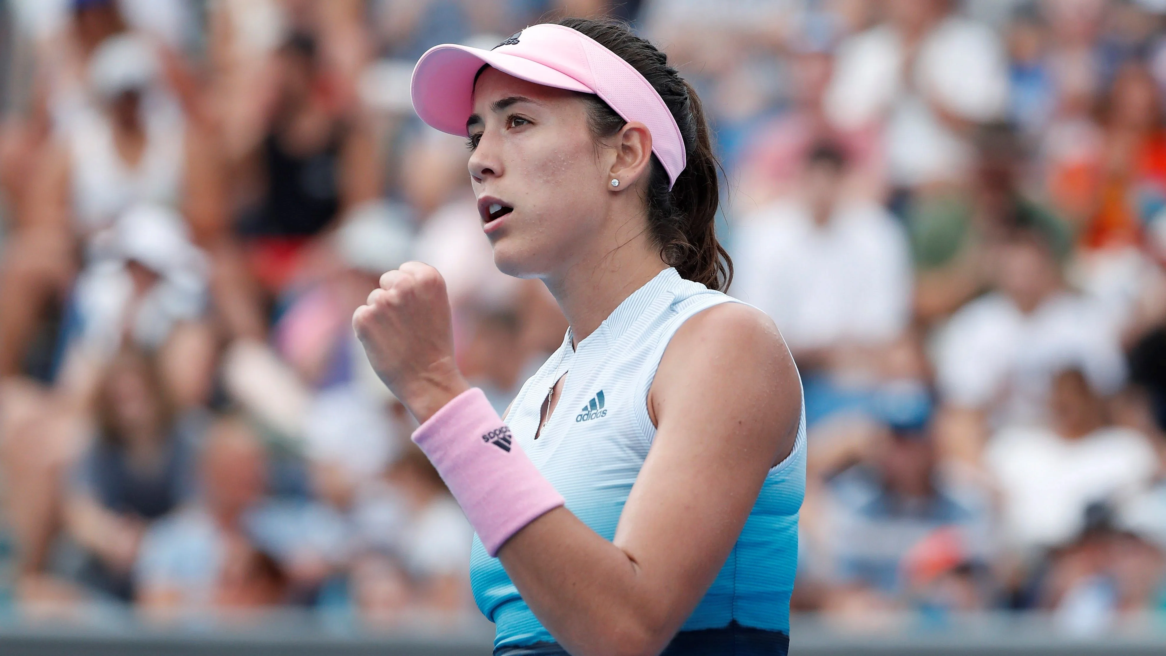 Garbiñe Muguruza celebra un punto en su estreno en el Open de Australia