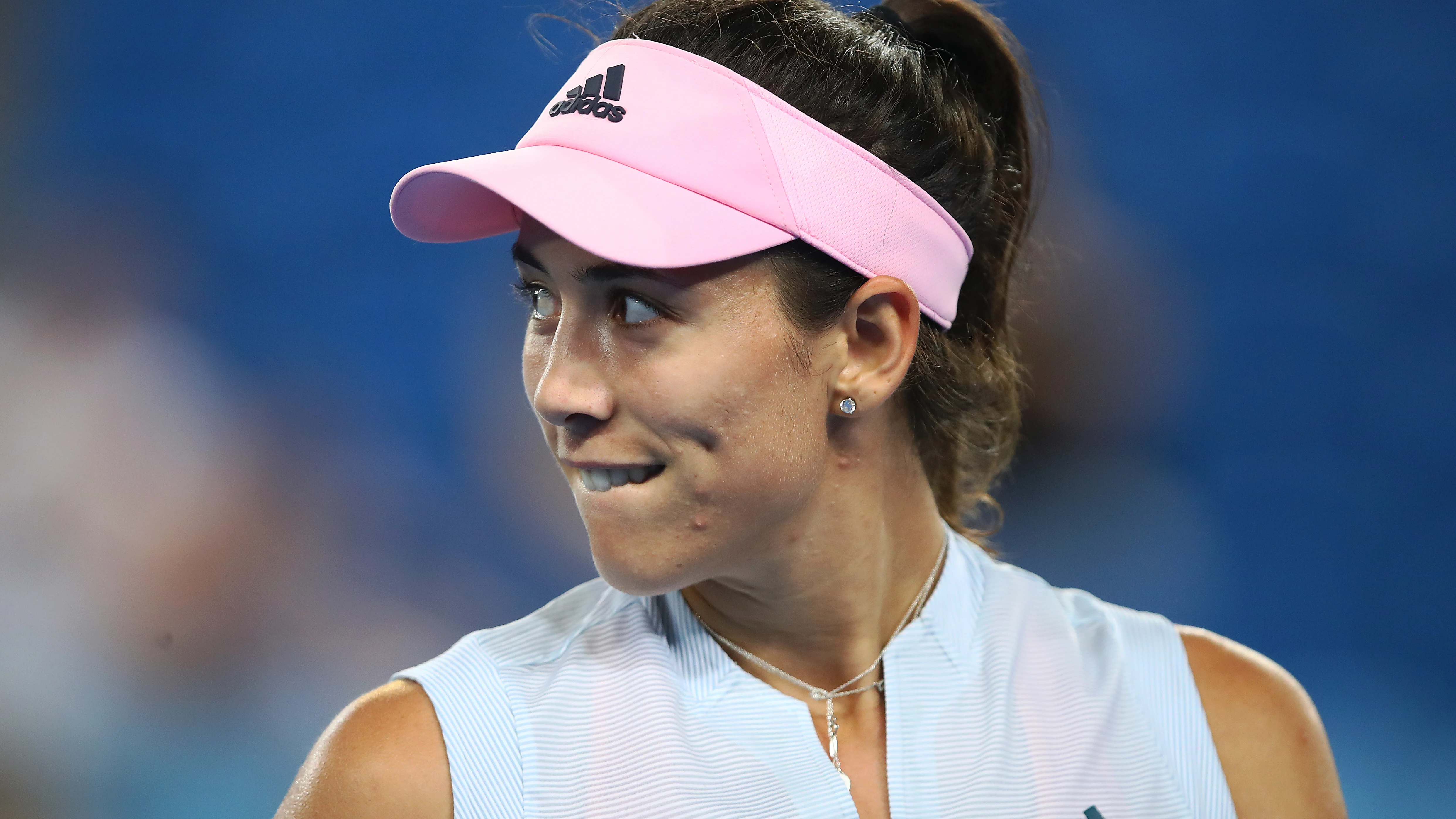 La tenista Garbiñe Muguruza sonríe en un partido