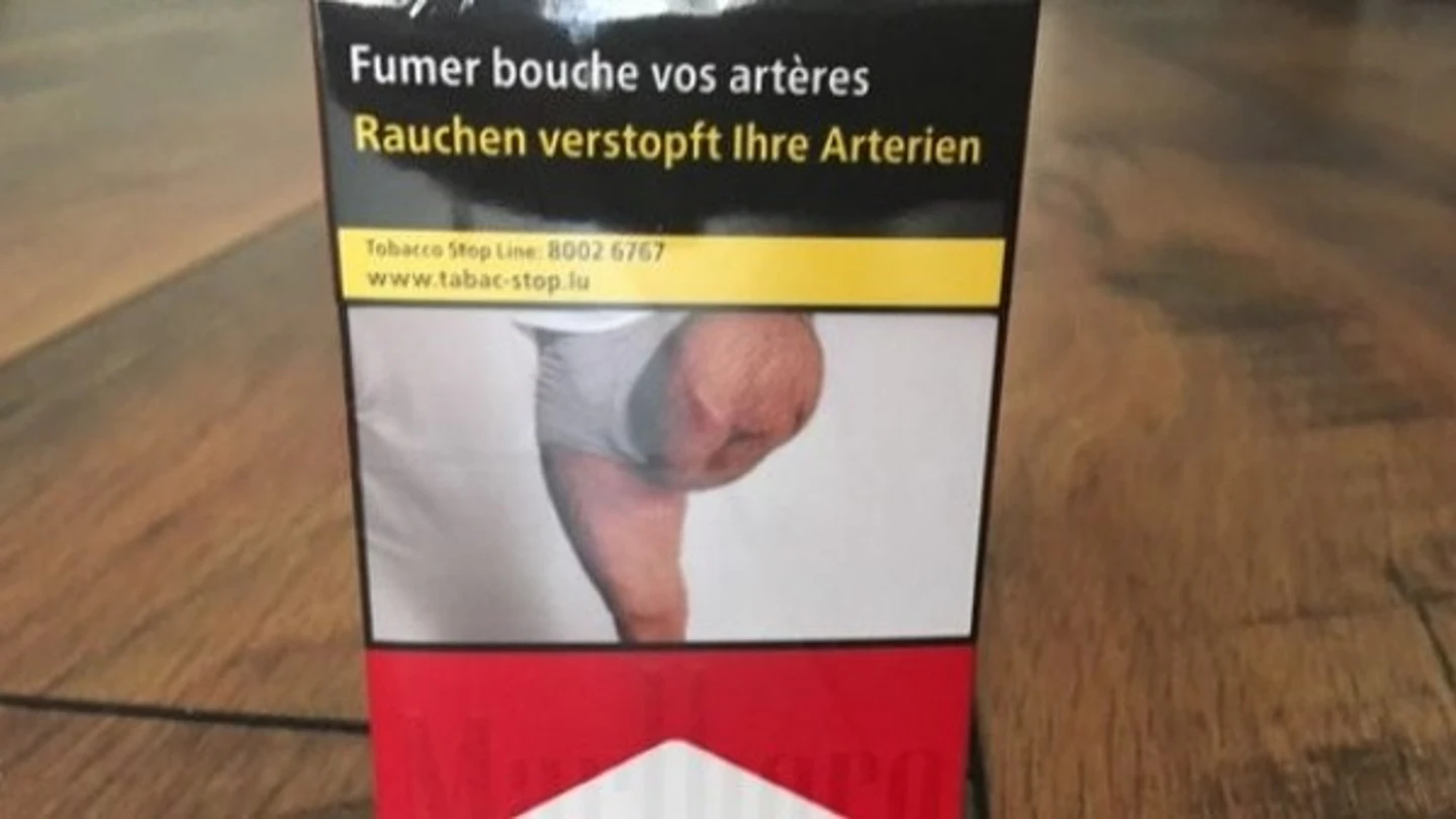 Caja de tabaco con la foto objeto de controversia Caja de tabaco con la foto objeto de controversia