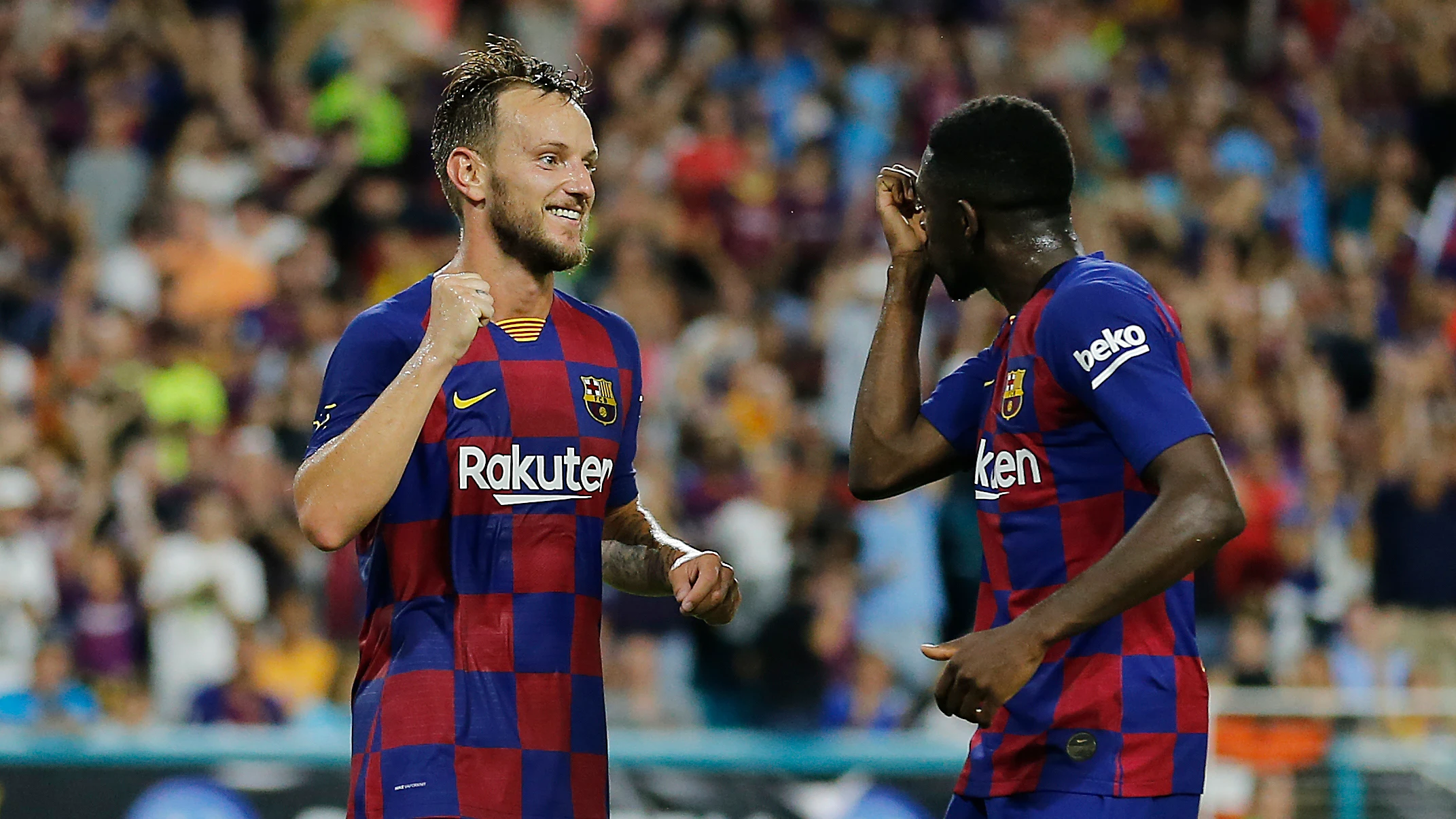 Ivan Rakitic y Ousmane Dembélé