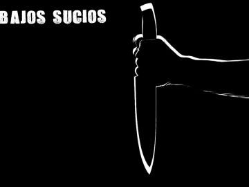 Una mano cogiendo un cuchillo Una mano cogiendo un cuchillo
