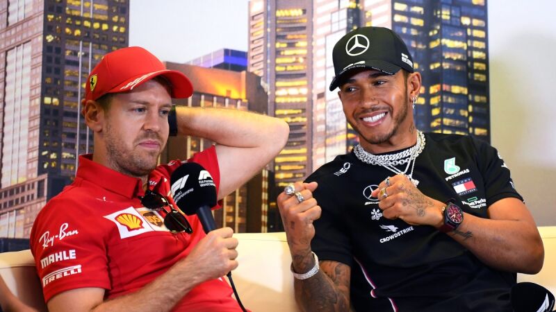 Sebastian Vettel, con Lewis Hamilton