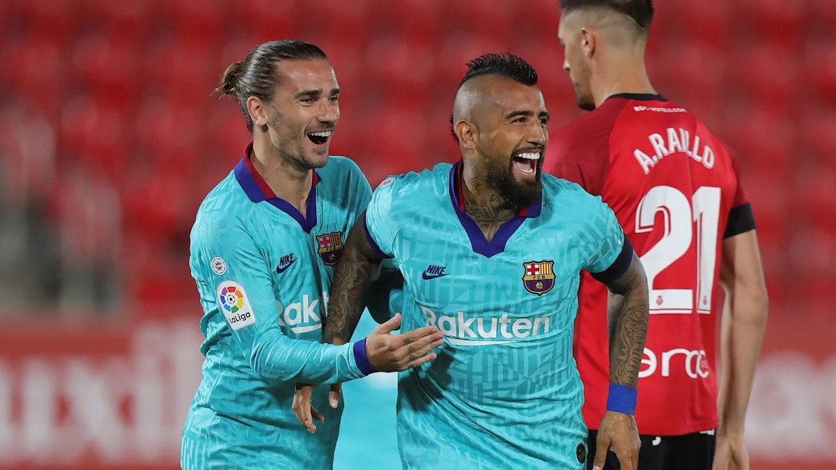 Antoine Griezmann, con Arturo Vidal