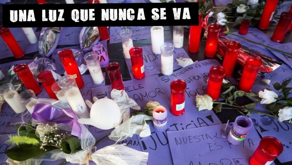 Imagen de archivo de flores y velas contra la violencia machista 