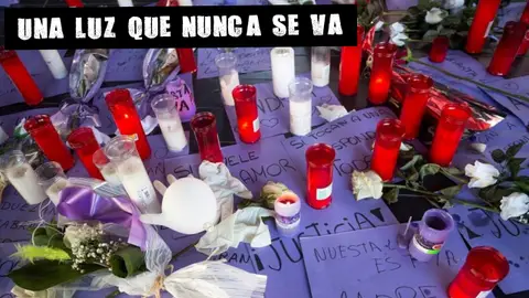 Imagen de archivo de flores y velas contra la violencia machista Imagen de archivo de flores y velas contra la violencia machista
