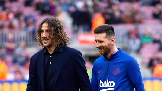 Carles Puyol y Leo Messi Carles Puyol y Leo Messi