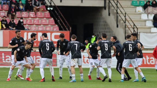 Varios jugadores del DUX, en un calentamiento previo a un partido Varios jugadores del DUX, en un calentamiento previo a un partido
