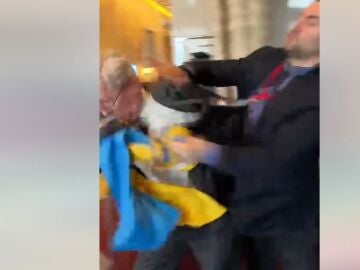 A Ukrainian representative punches a Russian representative during a summit in Turkey