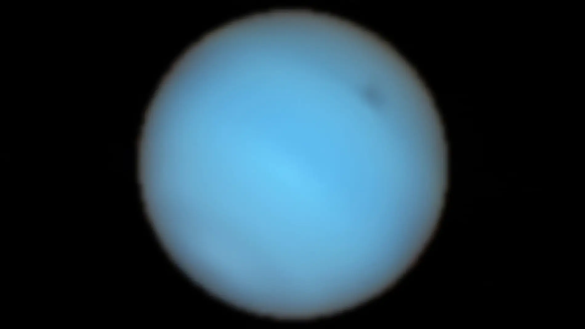 Vista de Neptuno tomada por el instrumento MUSE en la que se aprecia la mancha oscura