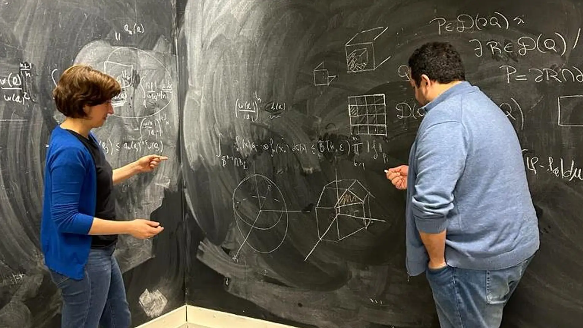 Dos matemáticos en una reunión de trabajo Dos matemáticos en una reunión de trabajo