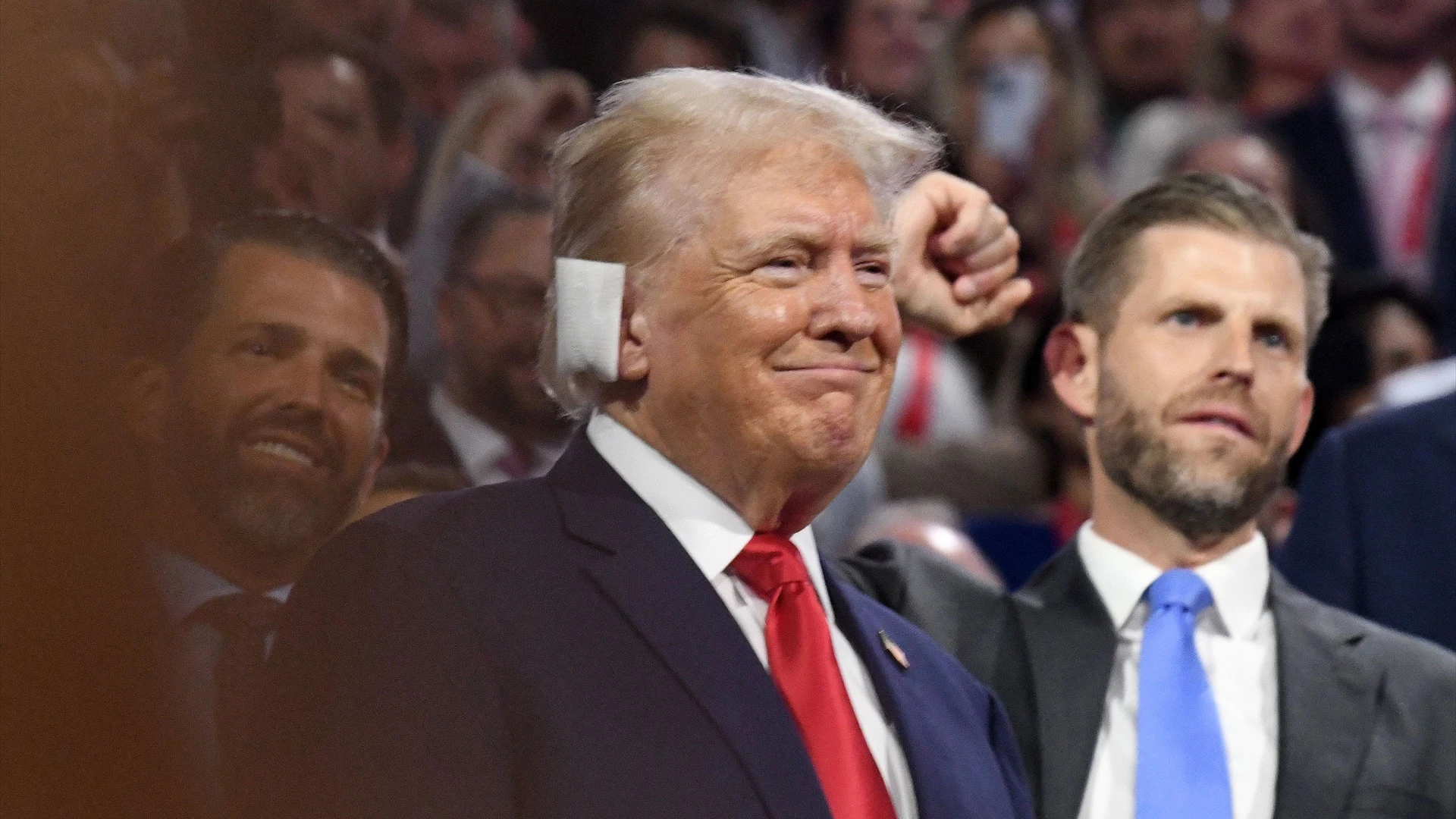 American businessman and Donald Trump's son, US former President and 2024 Republican presidential candidate Donald Trump and his son Eric Trump attend the first day of the 2024 Republican National Convention at the Fiserv Forum Arena in Milwaukee.