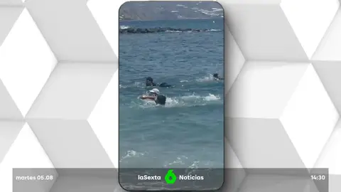migrantes placados por bañistas migrantes placados por bañistas