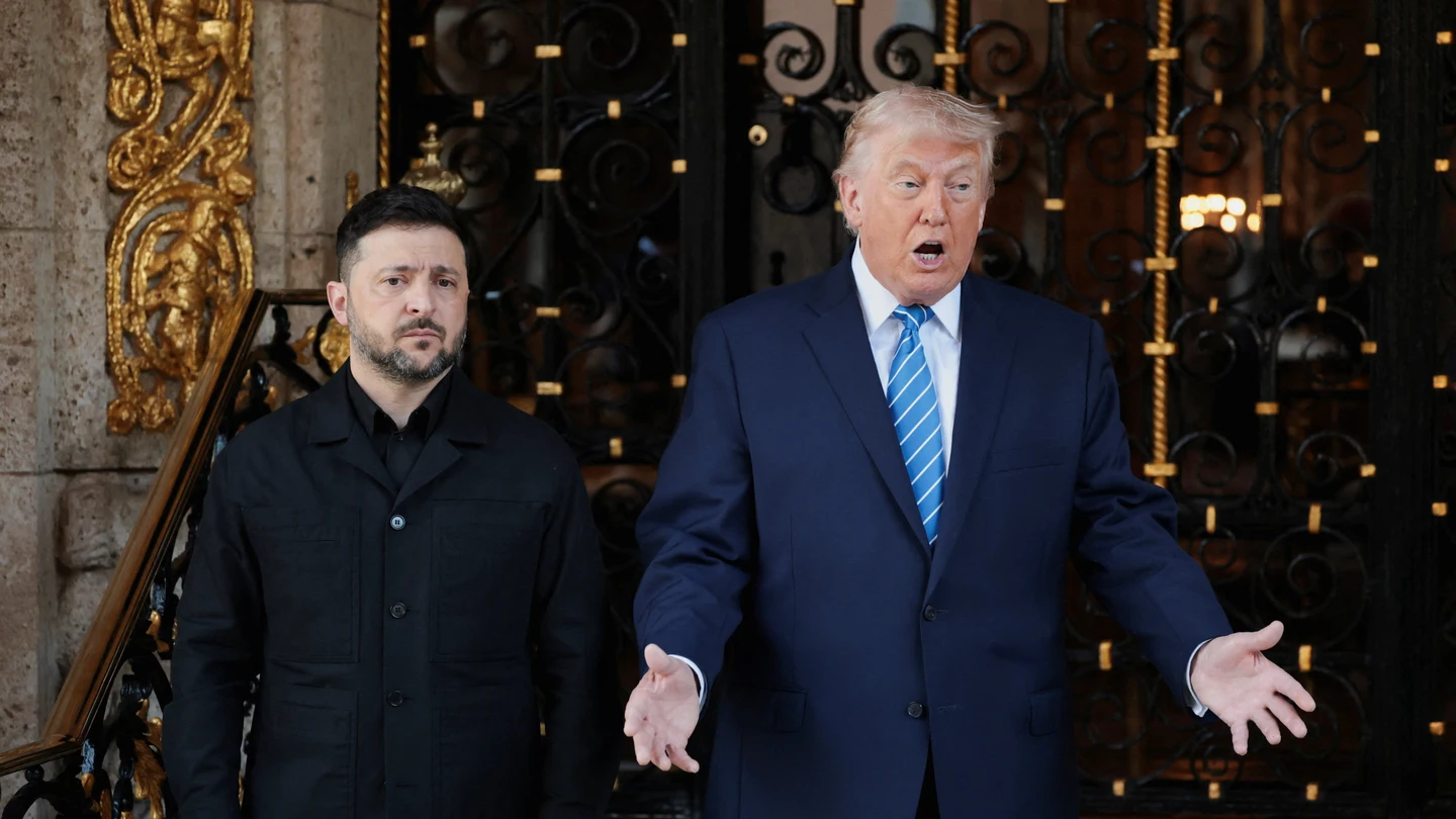 Ukrainian President Volodymyr Zelenskiy stands next to U.S. President Donald Trump Ukrainian President Volodymyr Zelenskiy stands next to U.S. President Donald Trump