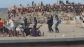 Imagen de los altercados entre migrantes y Polic&iacute;a en la playa del Trampol&iacute;n (Ceuta)