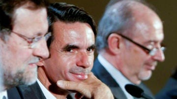 Aznar, Rato y Rajoy, juntos en un acto
