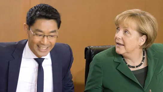 El ministro alemán de Economía, Philipp Rösler, y la canciller alemana, Angela Merkel El ministro alemán de Economía, Philipp Rösler, y la canciller alemana, Angela Merkel
