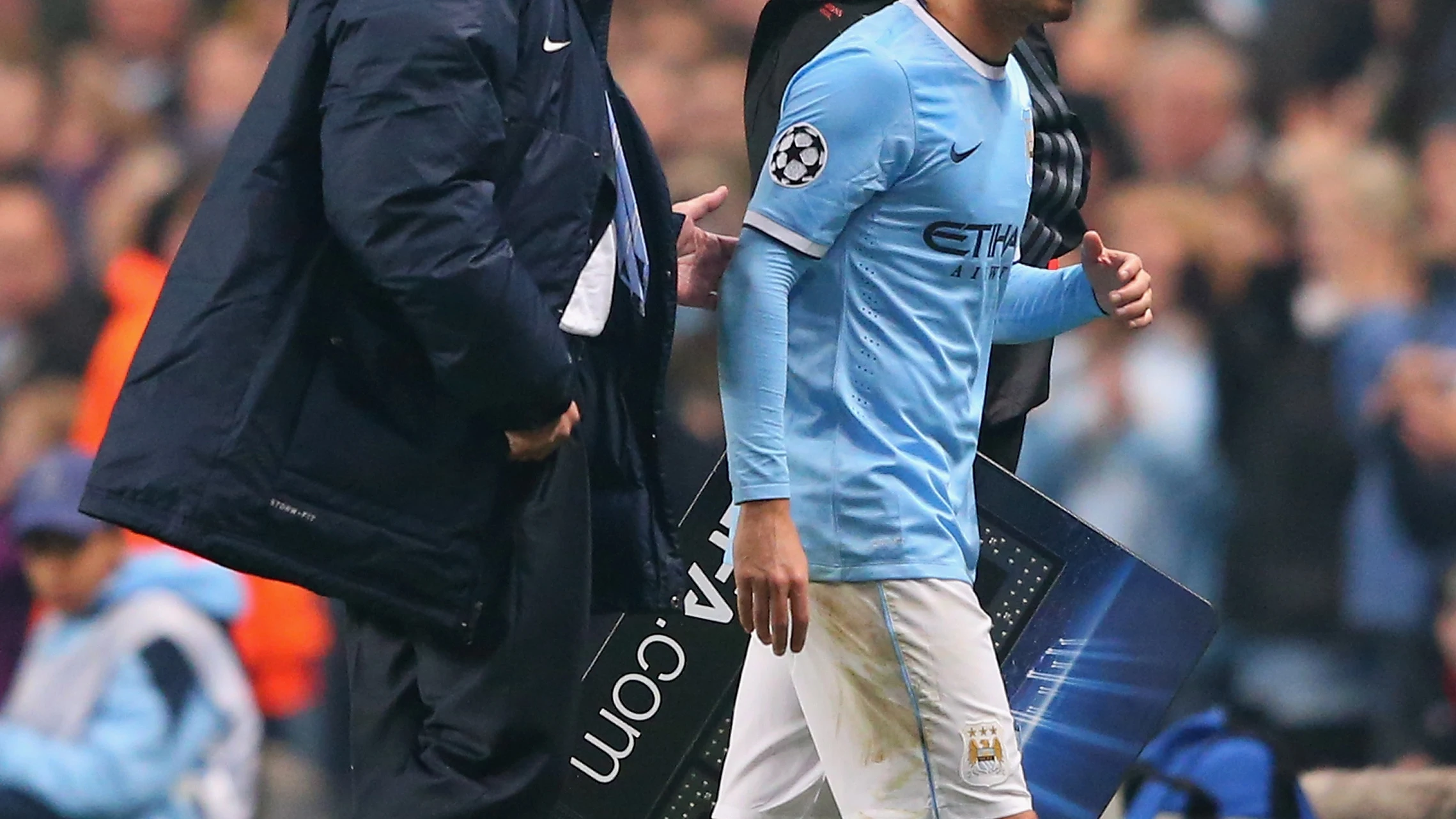 Pellegrini y David Silva durante un encuentro con el Manchester City