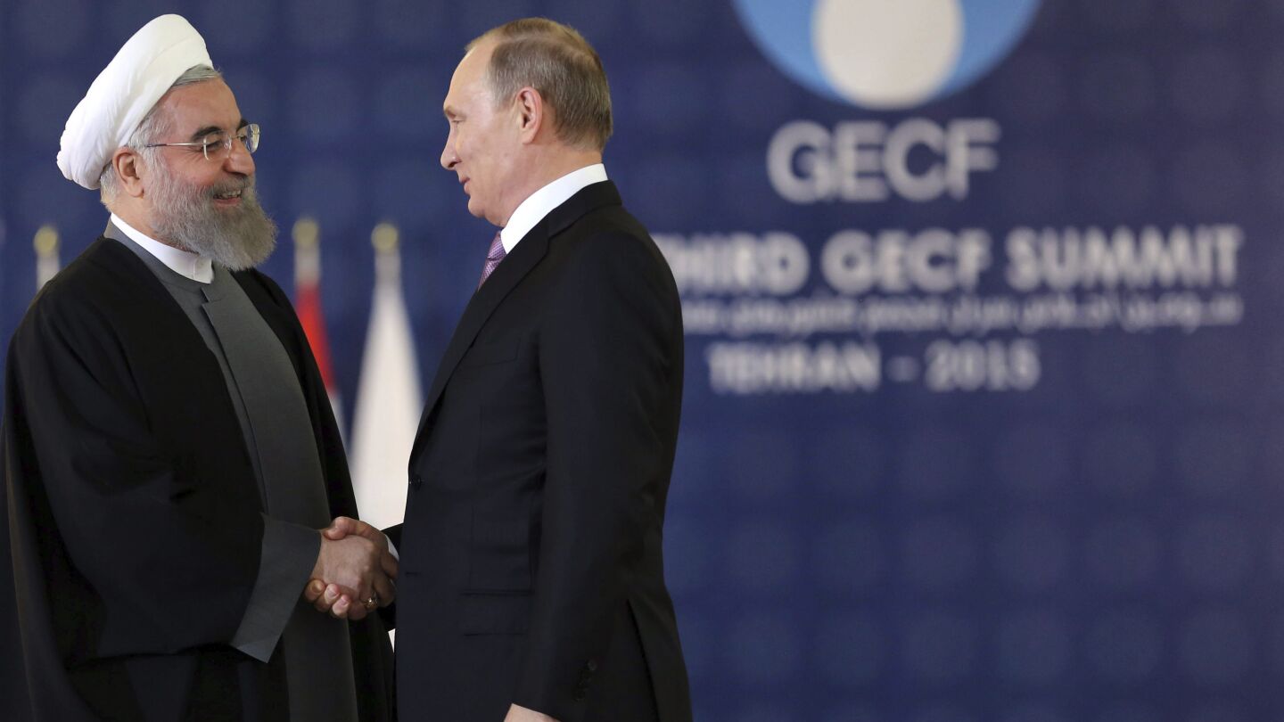 El presidente iran&iacute;, Has&aacute;n Rohan&iacute; (izq), junto a su hom&oacute;logo ruso, Vlad&iacute;mir Putin