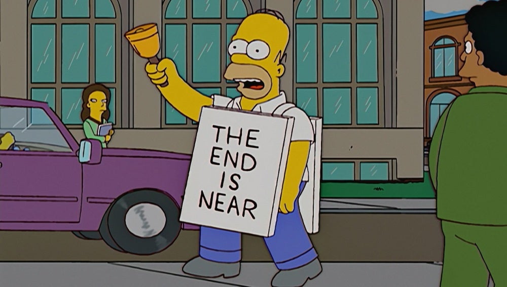 Homer Simpson con un cartel que reza 'El final se acerca'