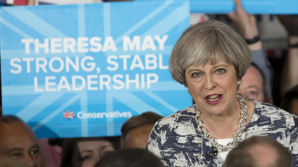 Theresa May en un acto electoral