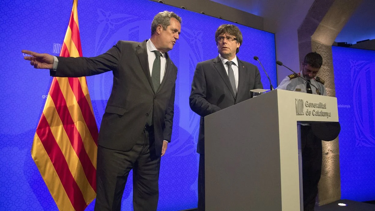 El expresidente catalán, Puigdemont, junto al exconseller de Interior, Forn