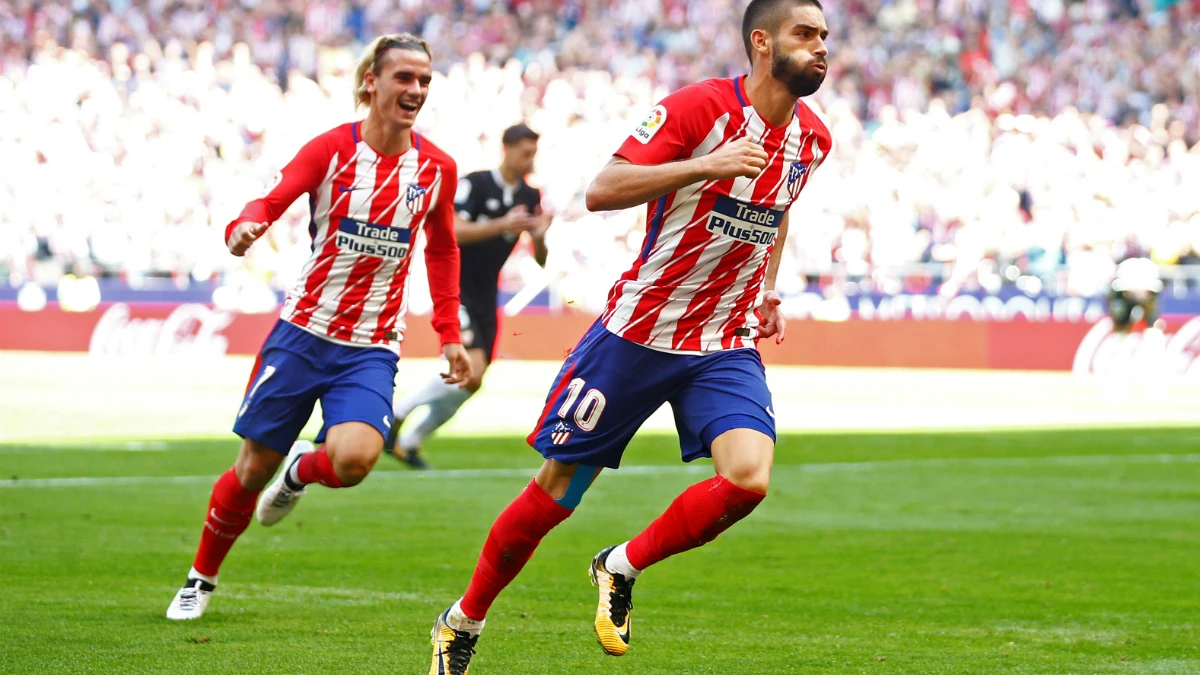 Carrasco y Griezmann celebran un gol