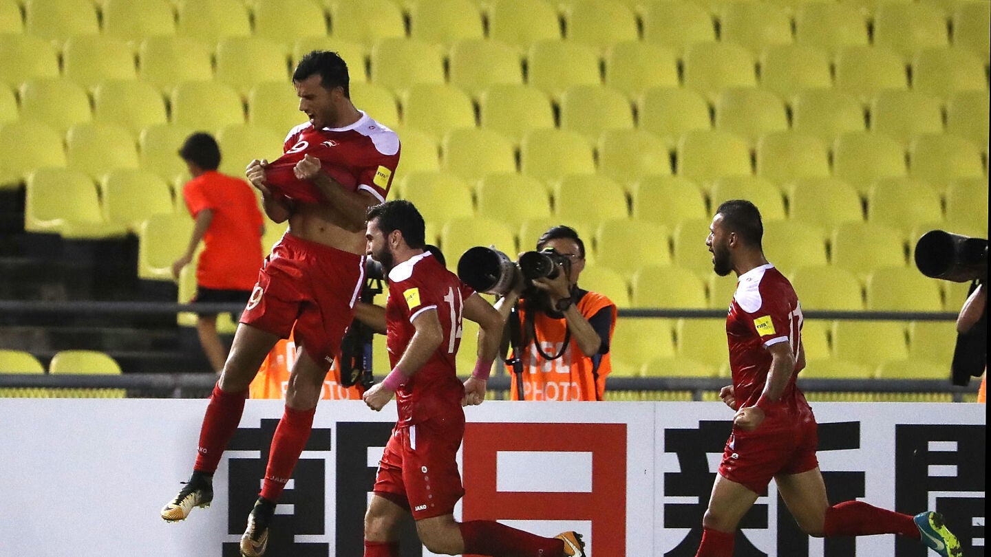 Los jugadores sirios celebran su gol contra Australia