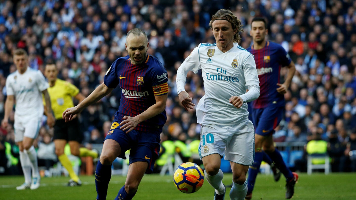 Iniesta, ante Modric