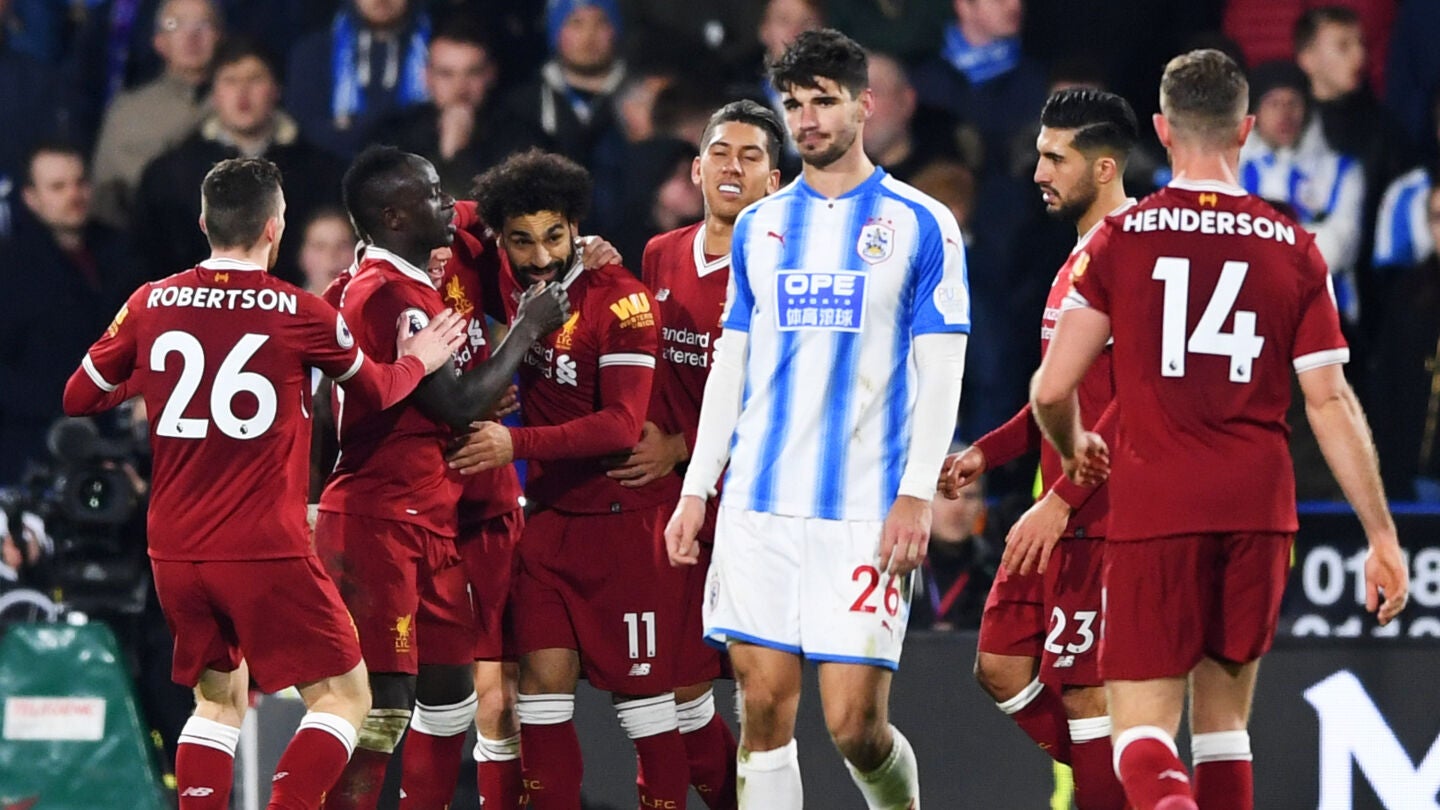 Los jugadores del Liverpool celebran uno de los goles ante el Huddersfield