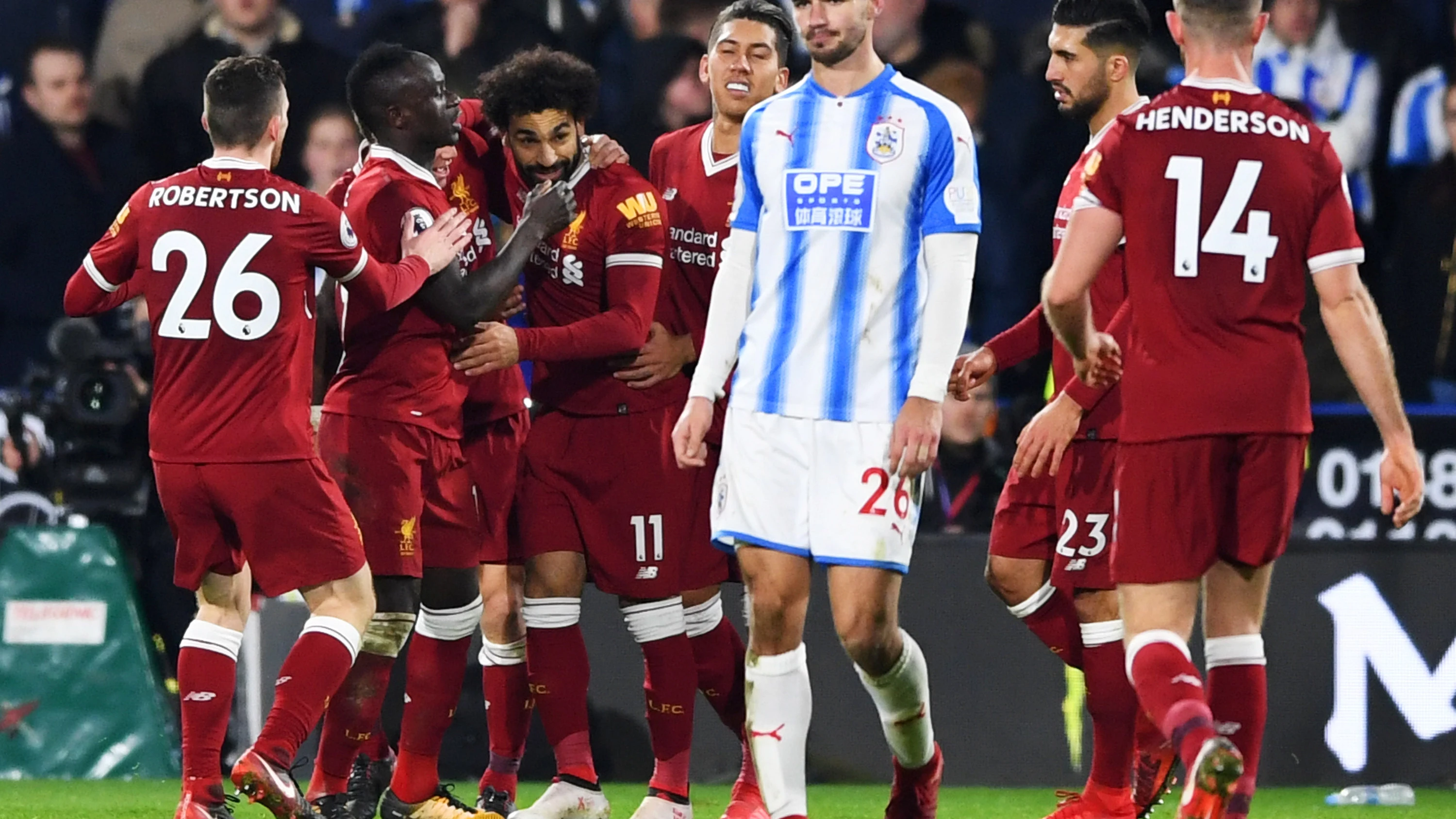 Los jugadores del Liverpool celebran uno de los goles ante el Huddersfield